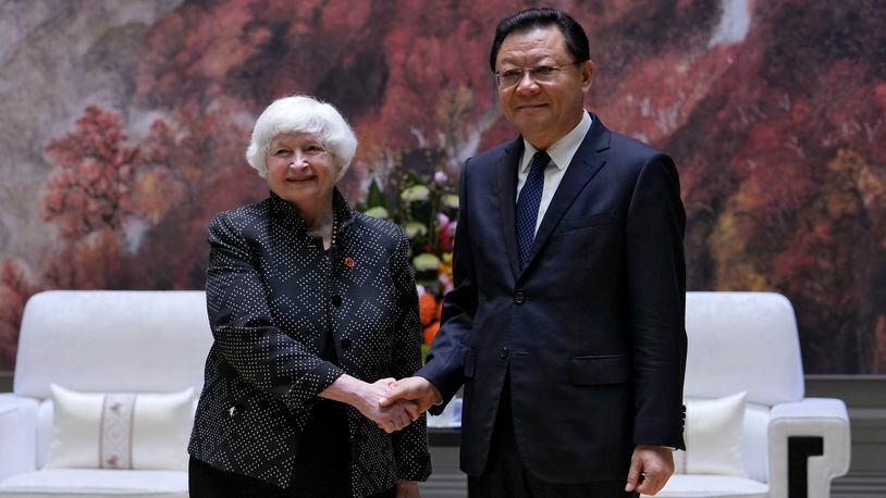 U.S. Treasury Secretary Janet Yellen, left, shakes hands with Wang Weizhong, deputy party secretary and governor of Guangdong prior to a meeting at the Baiyun International Conference Center (BICC) in southern China's Guangdong province, Friday, April 5, 2024. Yellen has arrived in China for five days of meetings in a country that's determined to avoid open conflict with the United States. (AP Photo/Andy Wong, Pool)