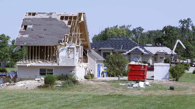 Homes damaged by the Memorial Day tornado on Country View Lane in Clayton, shown two months after the twister struck. STAFF FILE PHOTO
