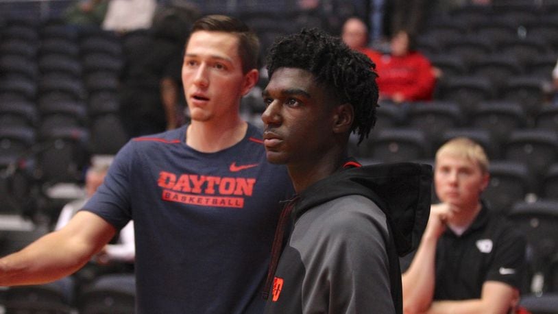 Kira Lewis, right, talks with Dayton's Ryan Mikesell before a game against Ball State on Friday, Nov. 10, 2017, at UD Arena.
