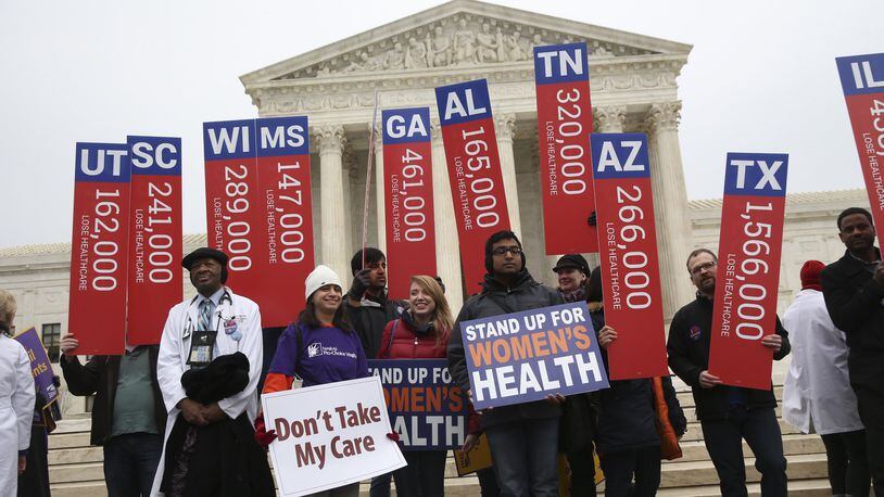 FILE — Protesters hold signs with estimates of the numbers who could lose health insurance in each state if the verdict of King v. Burwell went against the Affordable Care Act, outside the Supreme Court in Washington, March 4, 2015. The Republican plan to delay repealing the ACA could cause a zombie market, not dead, but not alive, that would suffer from many of the maladies of the existing system, and quite a few more. (Doug Mills/The New York Times)