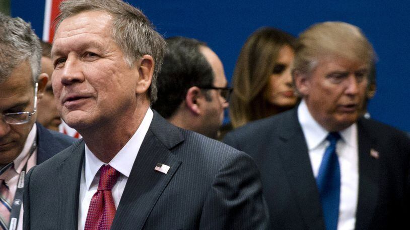In one of his first appearances since Donald Trump was sworn in as president, Ohio Gov. John Kasich refused to outright criticize his erstwhile political rival, instead insisting on giving the new president a break. (AP Photo/Matt Rourke)