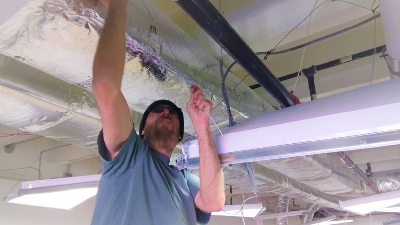 An electrician does renovations at Emerge Recovery and Trade initiative in Xenia, as the nonprofit prepares to open its recovery center for men next year. CONTRIBUTED