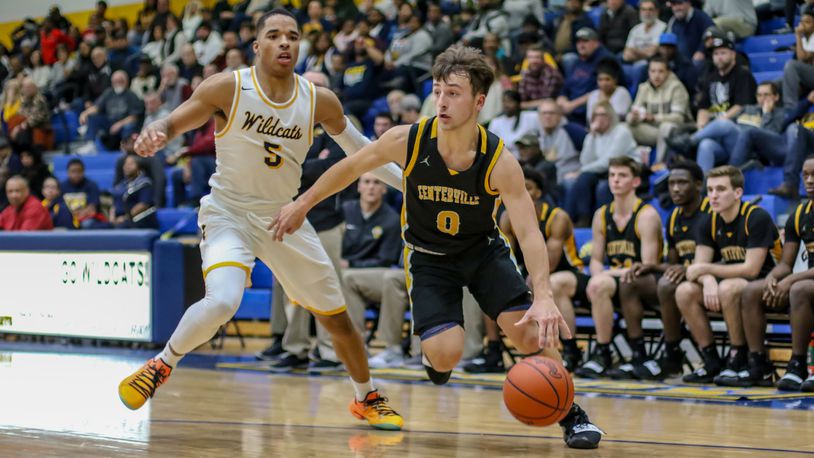 Centerville High School’s Ryan Marchal drives past Springfield’s Ra’Heim Moss during their game on Friday night in Springfield. The Elks won 60-44. CONTRIBUTED PHOTO BY MICHAEL COOPER