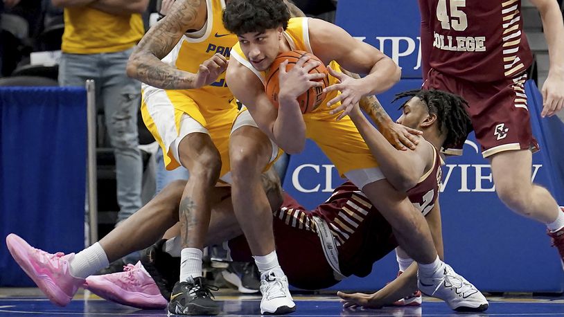 Pittsburgh forward Nate Santos (5) pulls in a loose ball against Boston College forward Devin McGlockton (21) during the second half of an NCAA college basketball game in Pittsburgh, Tuesday, Feb. 14, 2023. Pittsburgh won 77-58. (AP Photo/Matt Freed)