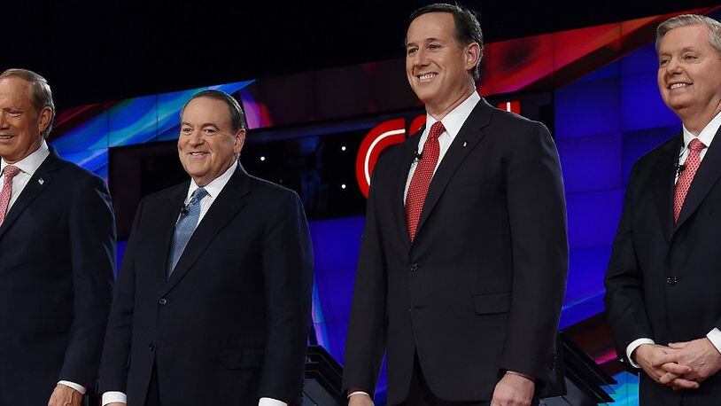 LAS VEGAS, NV - DECEMBER 15: Republican presidential candidates (L-R) George Pataki, Mike Huckabee, Rick Santorum and Sen. Lindsay Graham (R-SC) are introduced during the CNN presidential debate at The Venetian Las Vegas on December 15, 2015 in Las Vegas, Nevada. Thirteen Republican presidential candidates are participating in the fifth set of Republican presidential debates. (Photo by Ethan Miller/Getty Images)