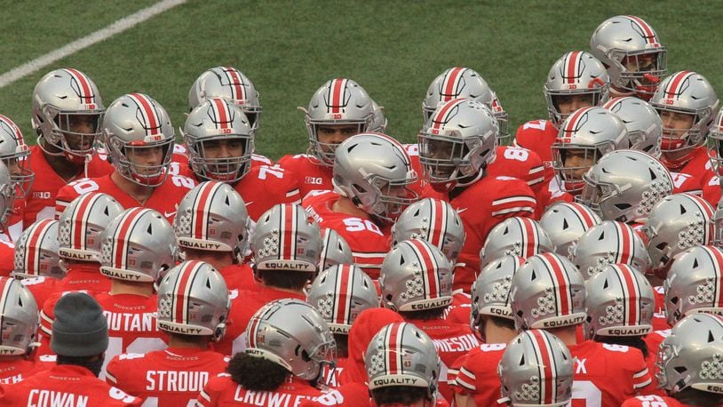 Ohio State players surround Josh Myers as he speaks before a game against Indiana on Saturday, Nov. 22, 2020, at Ohio Stadium in Columbus. David Jablonski/Staff