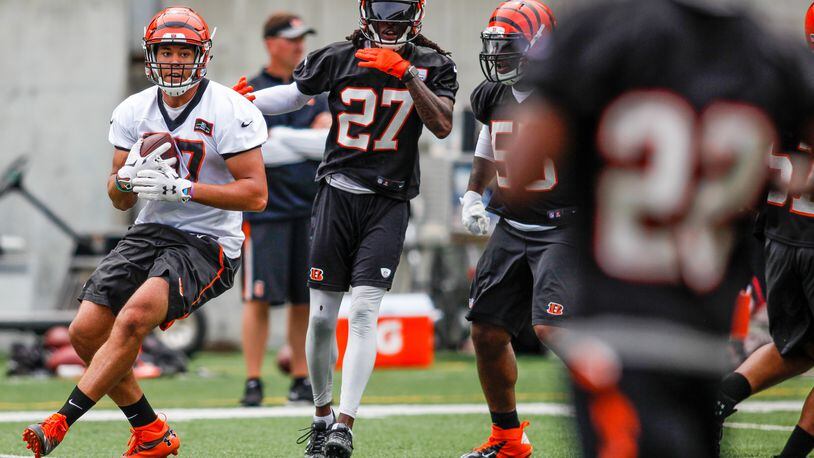Cincinnati Bengals tight end C.J. Uzomah carries the ball after a catch during the first day of mandatory mini camp Tuesday, June 14 at Paul Brown Stadium in Cincinnati. NICK GRAHAM/STAFF