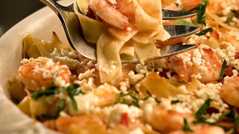 Shrimp, feta and tomatoes come together for a simple spaghetti dish that’s packed with flavor. (Bob Fila/Chicago Tribune/TNS)