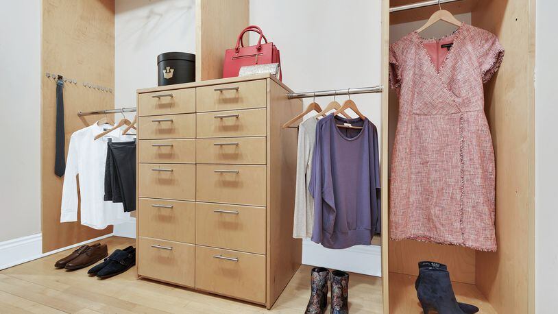 A built-in closet is made more attractive through the use of props and lifestyle elements. (Design Recipes)