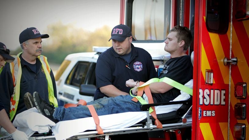 In this file photo, Riverside Fire Department medics load a man into a ambulance Friday afternoon, Nov. 3, 2017. (Jim Noelker/Staff)