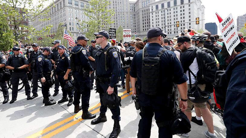 Law enforcement officers gather in Public Square on Thursday, July 21, 2016, in Cleveland, during the final day of the Republican convention. (AP Photo/Alex Brandon)