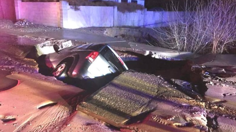 A sinkhole swallows an SUV in New Mexico.