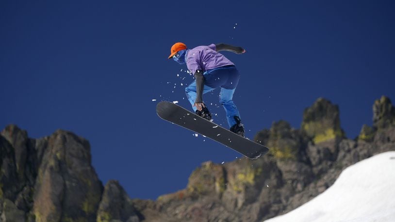 Max Ranall, of San Francisco, catches some air on his snowboard on the slopes of the “Gold Coast Face” run at Squaw Valley in Lake Tahoe, Calif. on Sunday, June 25, 2017. (Josie Lepe/Bay Area News Group/TNS)