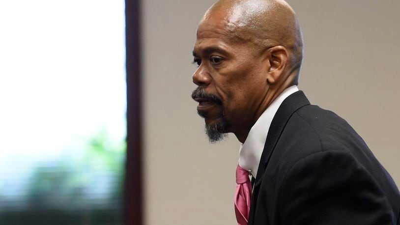Clyde Bennett II, attorney for Liz Rogers who is charged with impersonating a police officer, appeared in court on her behalf Tuesday in the Butler County Area III Court in West Chester Twp.  NICK GRAHAM/STAFF