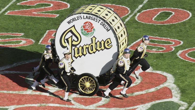 PASADENA, CA - JANUARY 1:  Members of the Purdue Boilermakers band pull the World's Largest Drum on the field during halftime of the game against the Washington Huskies on January 1, 2001 at the Rose Bowl in Pasadena, California.  Washington defeated Purdue 34-24.  (Photo by Donald Miralle/Getty Images)