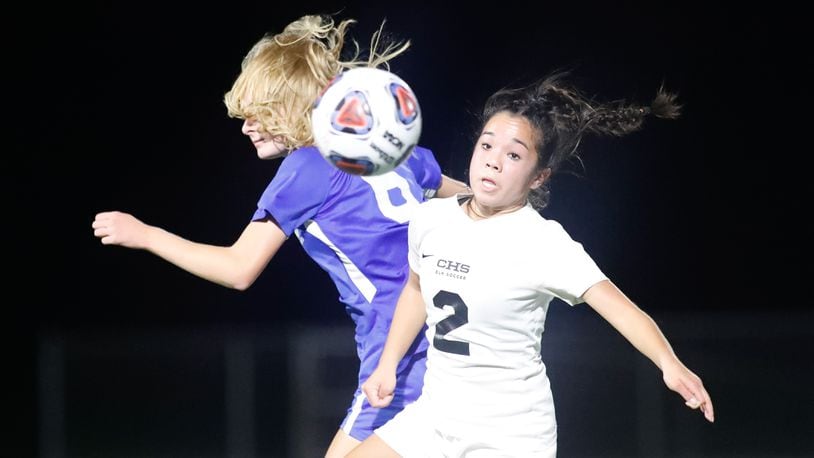 Cutline: Centerville High School junior midfielder Hailey Jeng watches the ball after colliding with Olentangy's Olivia Johnson during a Division I semifinal match on Tuesday night at Springfield High School. The Braves won 4-1. Michael Cooper/CONTRIBUTED