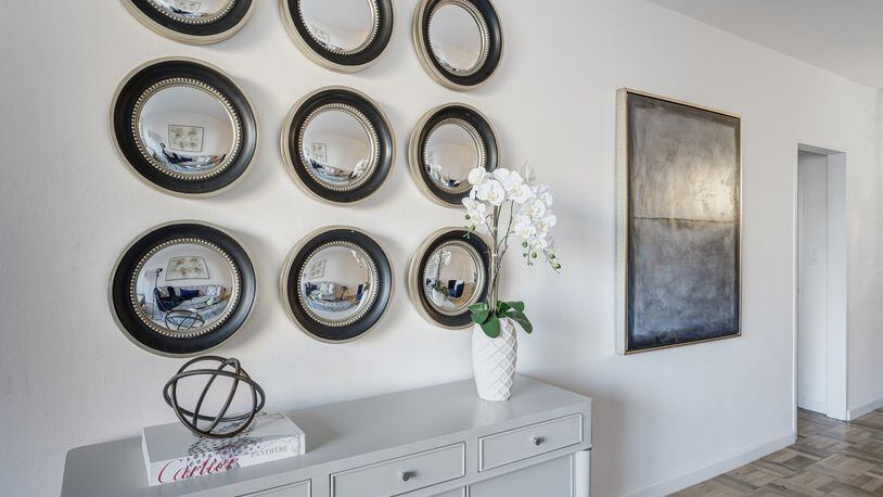 Using mirrors especially in a series is an easy and affordable way to create instant wall decor that is sophisticated at the same time. (Design Recipes)