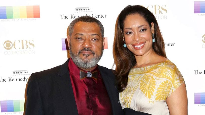 FILE - In this Dec. 6, 2015 file photo, Laurence Fishburne, left, and Gina Torres attend the 38th Annual Kennedy Center Honors at The Kennedy Center Hall of States in Washington. Court records in Los Angeles show that Fishburne filed for divorce from his wife of 15 years, Torres, on Thursday, Nov. 2, 2017, and is seeking joint custody of their 10-year-old daughter.