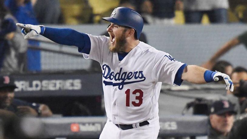Max Muncy celebrates after his 18th-inning solo homer gave the Dodgers a 3-2 win in Game 3 of the World Series.