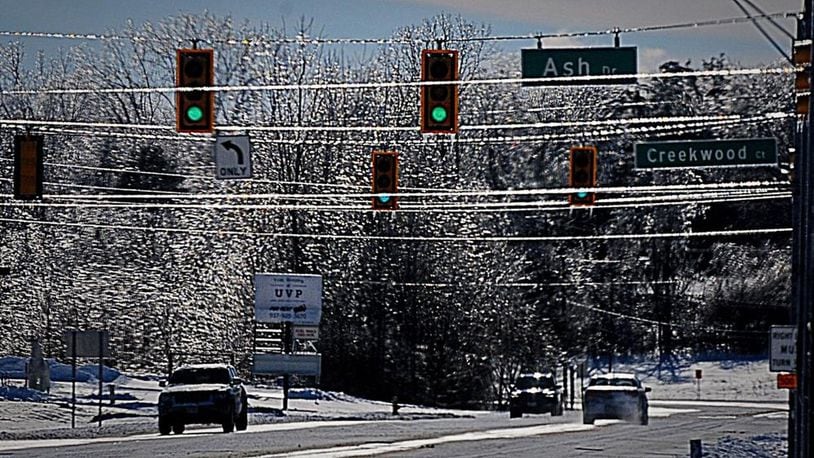 Trees and lines sparkle as they are covered with ice on Upper Valley Pike Sunday. Photo Marshall Gorby