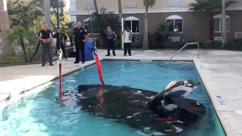 A man accidently backed his black Hyundai into a motel swimming pool Friday.