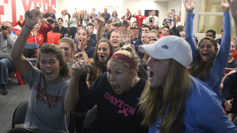 Dayton players celebrate after hearing their name called on the NCAA women’s soccer selection show Monday. David Jablonski/Staff