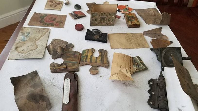 A portion of the artifacts a man doing home renovations found in a Massachusetts ceiling.