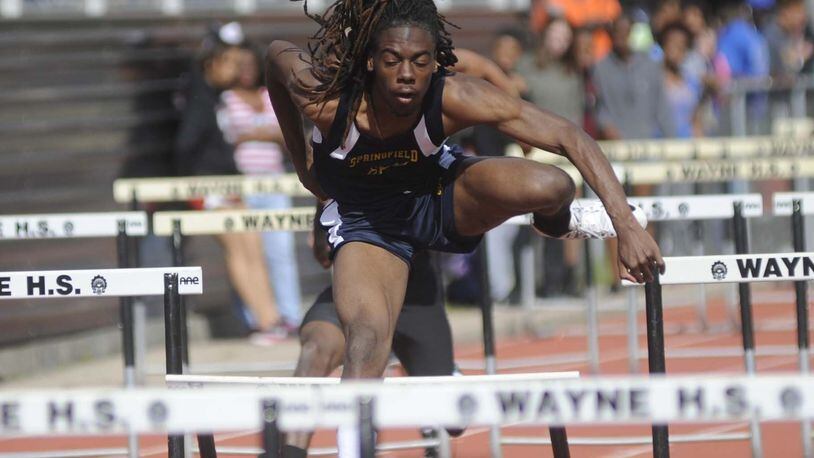 Springfield High School junior Dyier Smith, shown during Thursday’s qualifying, won the 110-meter high hurdles in a personal-best 14.42 on Friday during the rain-canceled Wayne track and field invitational at Huber Heights. MARC PENDLETON / STAFF