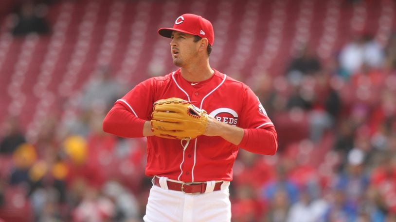 Reds starter Tyler Mahle prepares to pitch against the Cubs on Monday, April 2, 2018, at Great American Ball Park in Cincinnati. David Jablonski/Staff