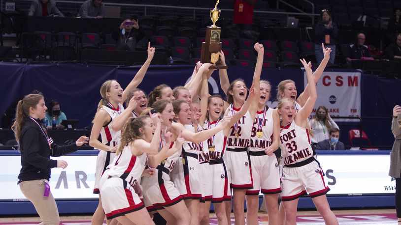 Fort Loramie's girls basketball team celebrates a Division IV state championship Saturday at UD Arena. Jeff Gilbert/CONTRIBUTED