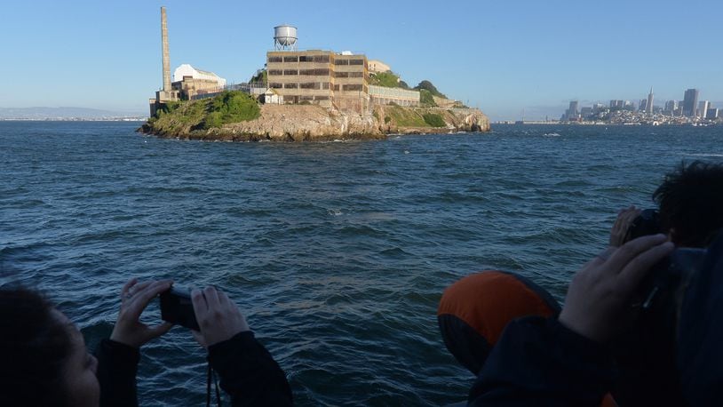 Visitors take photos while on the boat heading to the Alcatraz Night Tour on Alcatraz Island on Alcatraz Island on March 31, 2016. The night tour takes a few hundred visitors on activities not offered during the day. (Doug Duran/Bay Area News Group/TNS)