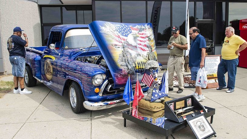 The Remembering Our Heroes ’57 Chevy 3200 Truck sits on display during its visit to the Wright-Patterson Air Force Base Exchange, Aug. 12. The truck is owned by retired Air Force Master. Sgt. Rick Breech and was built to be a rolling tribute to our nation’s fallen heroes from Operation Enduring Freedom and Operation Iraqi Freedom. (U.S. Air Force photo/Wesley Farnsworth)