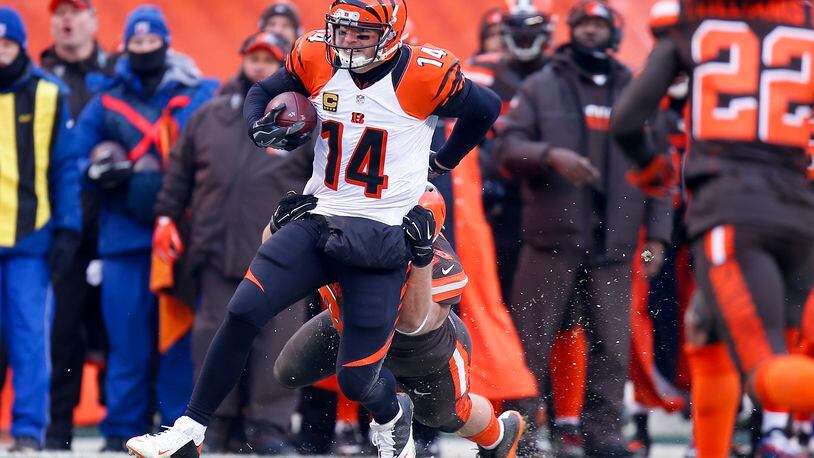 Bengals quarterback Andy Dalton has been known to run the ball now and then, as he did here against the Browns  last December 18 in Cleveland, but not like in this video game situation. No, definitely not like that.
