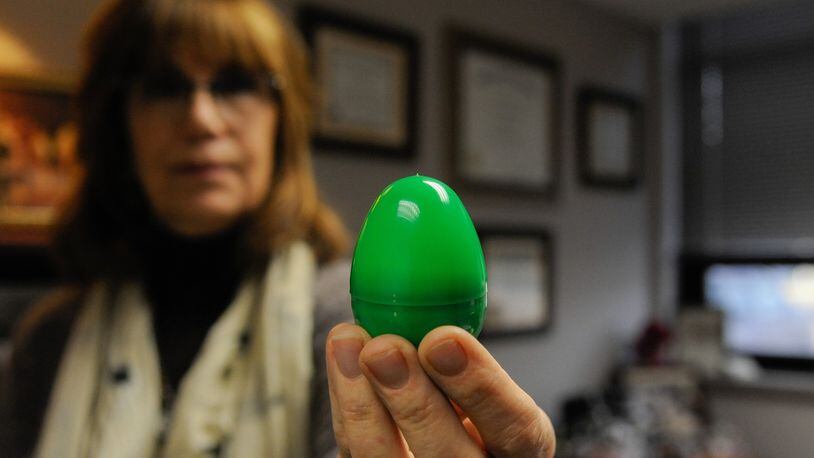 Vera Bowie, Violence Prevention Integrator, holds up one of the green eggs that will be hidden all over Wright-Patterson for this year’s Spring Fling egg hunt. The hunt will be held from March 12-23 all over Area A and Area B. (U.S. Air Force photo/SSgt Ashley Clingerman)