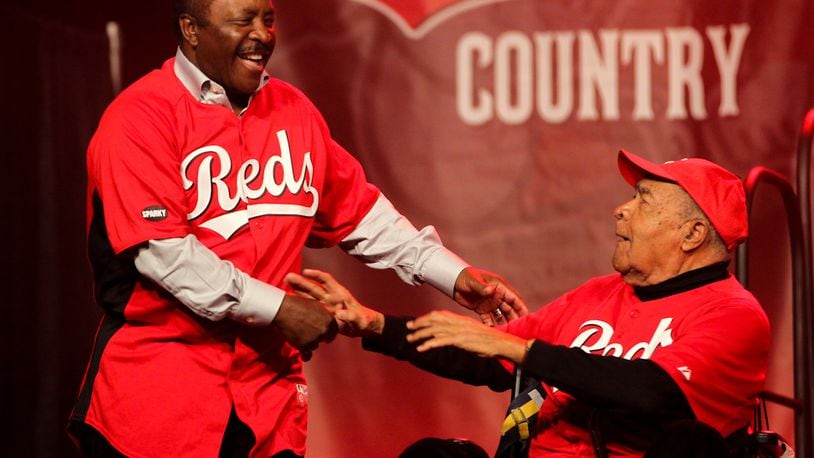 Chuck Harmon greets Joe Morgan as the former Reds are introduced during the opening day of RedsFest at the Duke Energy Convention Center in Cincinnati, Friday, Dec. 7, 2012. Staff photo by Greg Lynch
