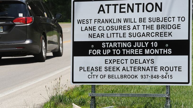 A sign alerts drivers in Bellbrook of upcoming lane closures on W. Franklin Street. MARSHALL GORBY\STAFF