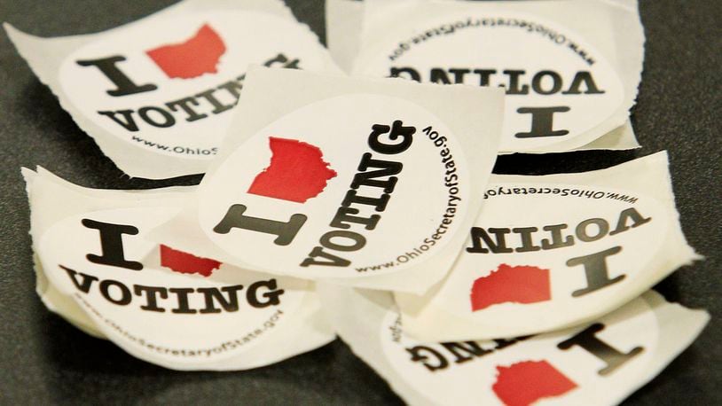 Voting stickers lay on a table  (Photo by Jay LaPrete/Getty Images)