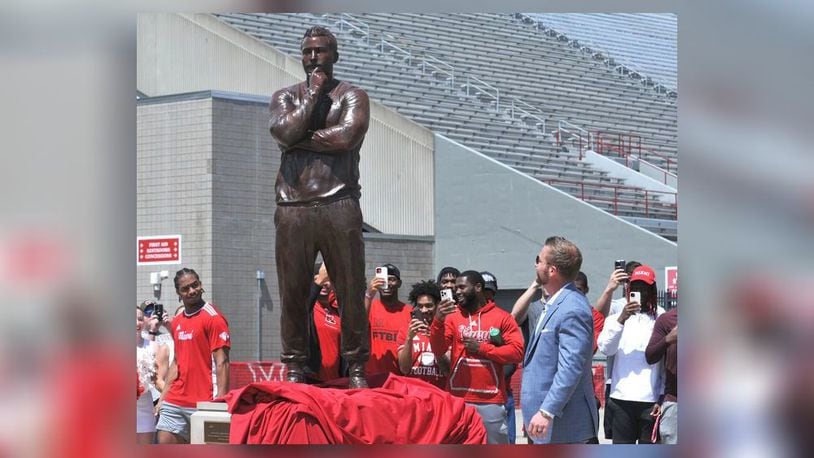 Sean McVay, head coach of the Los Angeles Rams and Miami University graduate, unveils his statue at the university's Cradle of Coaches Plaza on Saturday, May 6. McVay is the 10th Miami alumnus to be honored with a statue on the plaza. DAVID A. MOODIE/CONTRIBUTING PHOTOGRAPHER