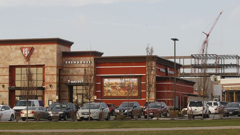 Miami Twp.’s Austin Landing is one of the major mixed retail and office developments expanding between Cincinnati and Dayton. TY GREENLEES / STAFF