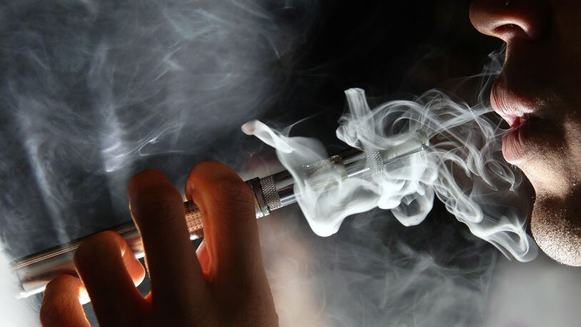 A man is pictured using an e-cigarette device. (Dan Kitwood/Getty Images)