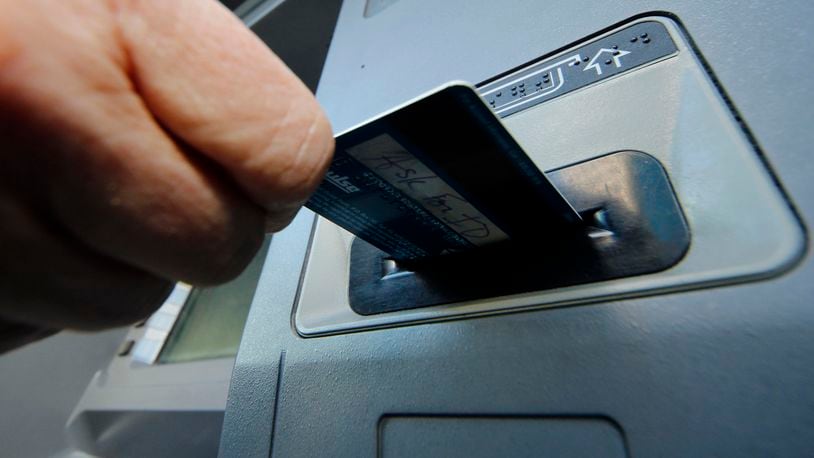 Kettering police say that skimming devices can be placed anywhere inside or around a credit card reader, and may wiggle out of place easily. They say if you notice any unusual objects protruding from the card reader, or security labels appear to be peeled off, do not use that machine. (AP Photo/Gene J. Puskar, File)