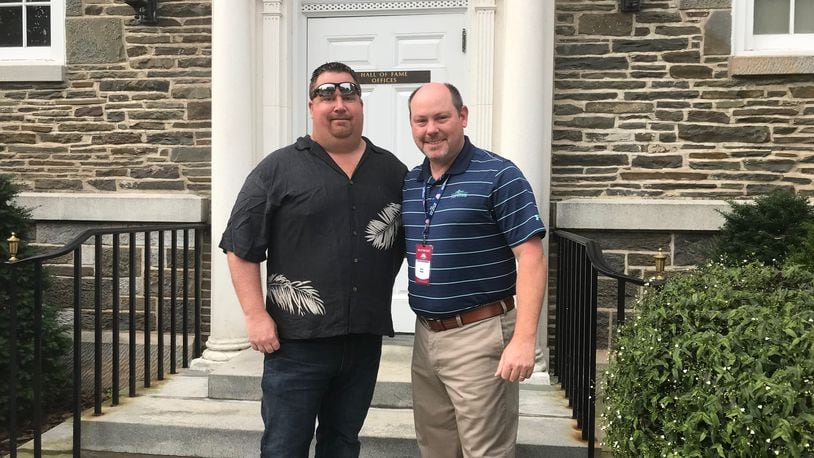 Mark Bowman, left, and Atlanta Braves media relations director Brad Hainje stand outside the Baseball Hall of Fame in 2018, the year Chipper Jones was inducted.