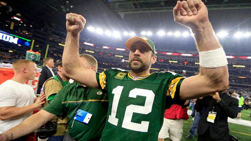 Green Bay Packers quarterback Aaron Rodgers (12) celebrates after winning an NFL divisional playoff football game against the Dallas Cowboys Sunday, Jan. 15, 2017, in Arlington, Texas. The Packers won 34-31. (AP Photo/Ron Jenkins)
