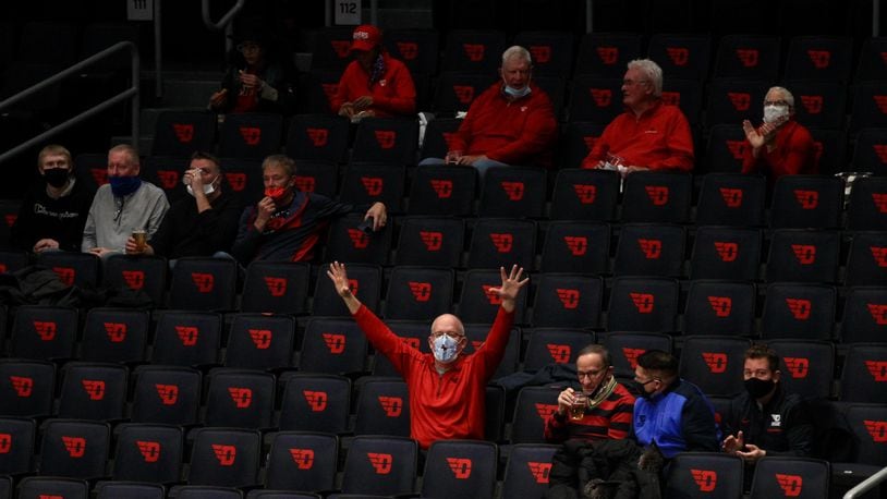 Dayton fans celebrate after a basket against Duquesne on Wednesday, Jan. 13, 2021, at UD Arena. David Jablonski/Staff