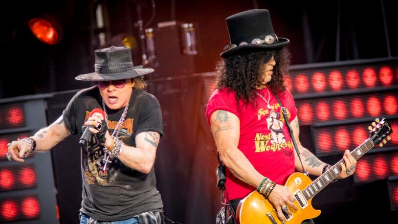 Axl Rose  (left) and Slash of Guns N' Roses perform onstage during the 'Not In This Lifetime' Tour.
