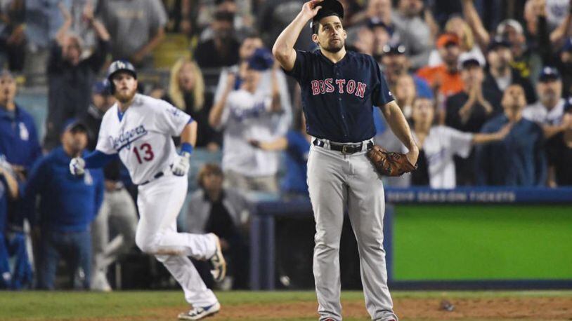 Boston pitcher Nathan Eovaldi can only watch as Max Muncy ends Game 3 of the World Series with an 18th-inning home run.