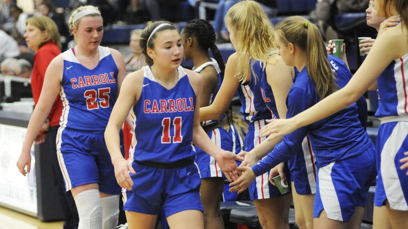 Carroll sophomores Ava Lickliter (11) and Megan Leraas (25) helped the Patriots tie Poland Seminary as the Division II girls basketball state poll champs. MARC PENDLETON / STAFF