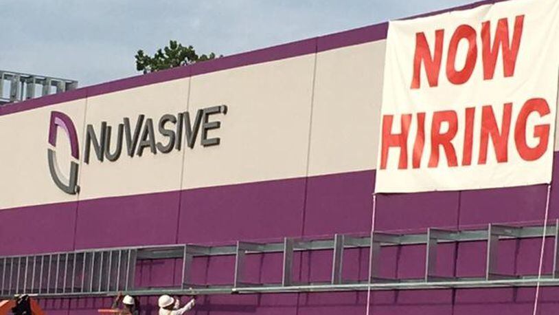 NuVasive in West Carrollton is among several businesses and employers set to take part in a free job fair Saturday. NICK BLIZZARD/STAFF