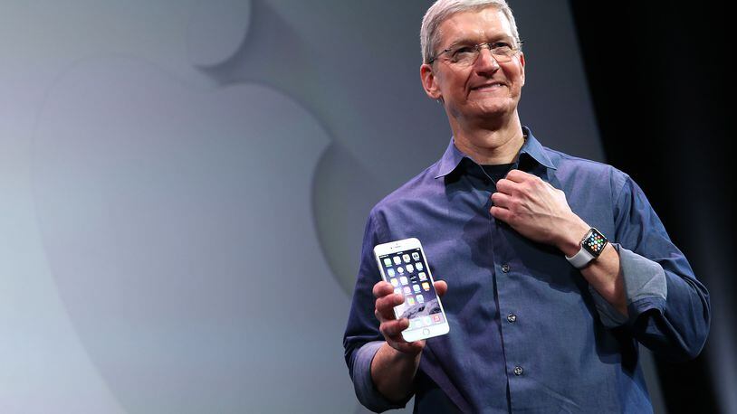 CUPERTINO, CA - SEPTEMBER 09: Apple CEO Tim Cook shows off the new iPhone 6 and the Apple Watch during an Apple special event at the Flint Center for the Performing Arts on September 9, 2014 in Cupertino, California. Apple is expected to unveil the new iPhone 7 at its event September 7, 2016. (Photo by Justin Sullivan/Getty Images)
