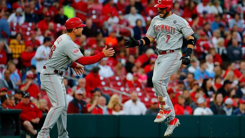 ST. LOUIS, MO - APRIL 26: Eugenio Suarez #7 of the Cincinnati Reds is congratulated by coach J.R. House #56 of the Cincinnati Reds after hitting a home run against the St. Louis Cardinals in the first inning at Busch Stadium on April 26, 2019 in St. Louis, Missouri.  (Photo by Dilip Vishwanat/Getty Images)